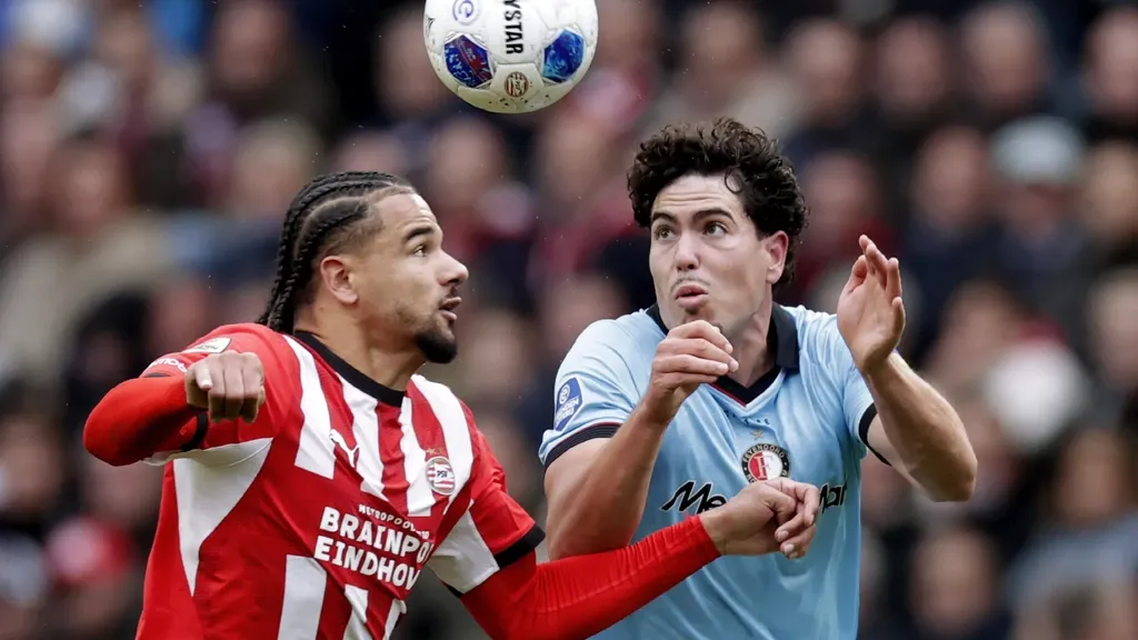 Leader Feyenoord fends off PSV’s surge in gripping top match