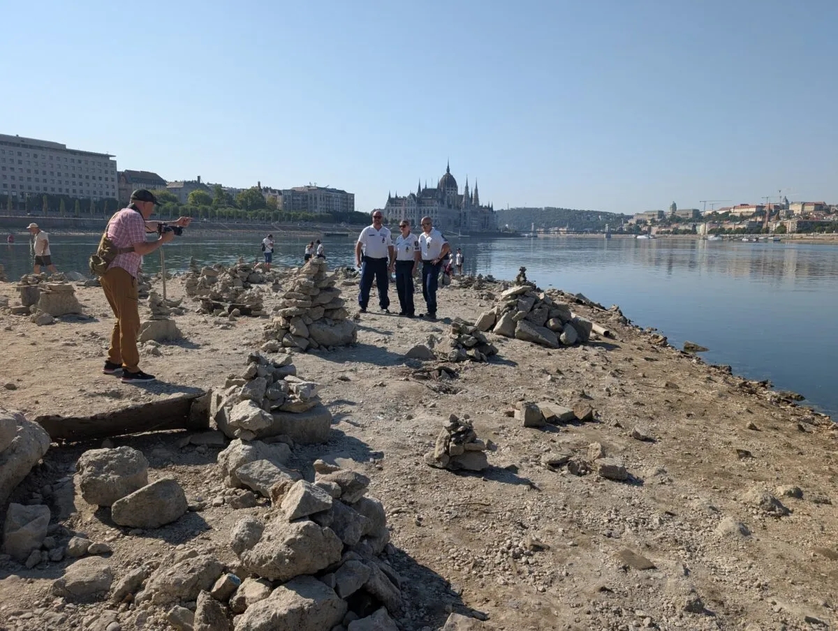 Police posing for promotional photos beneath Margaret Bridge