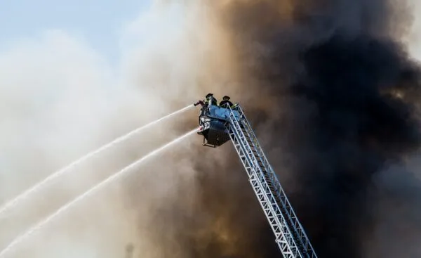 Firefighting aircraft over a burning forest