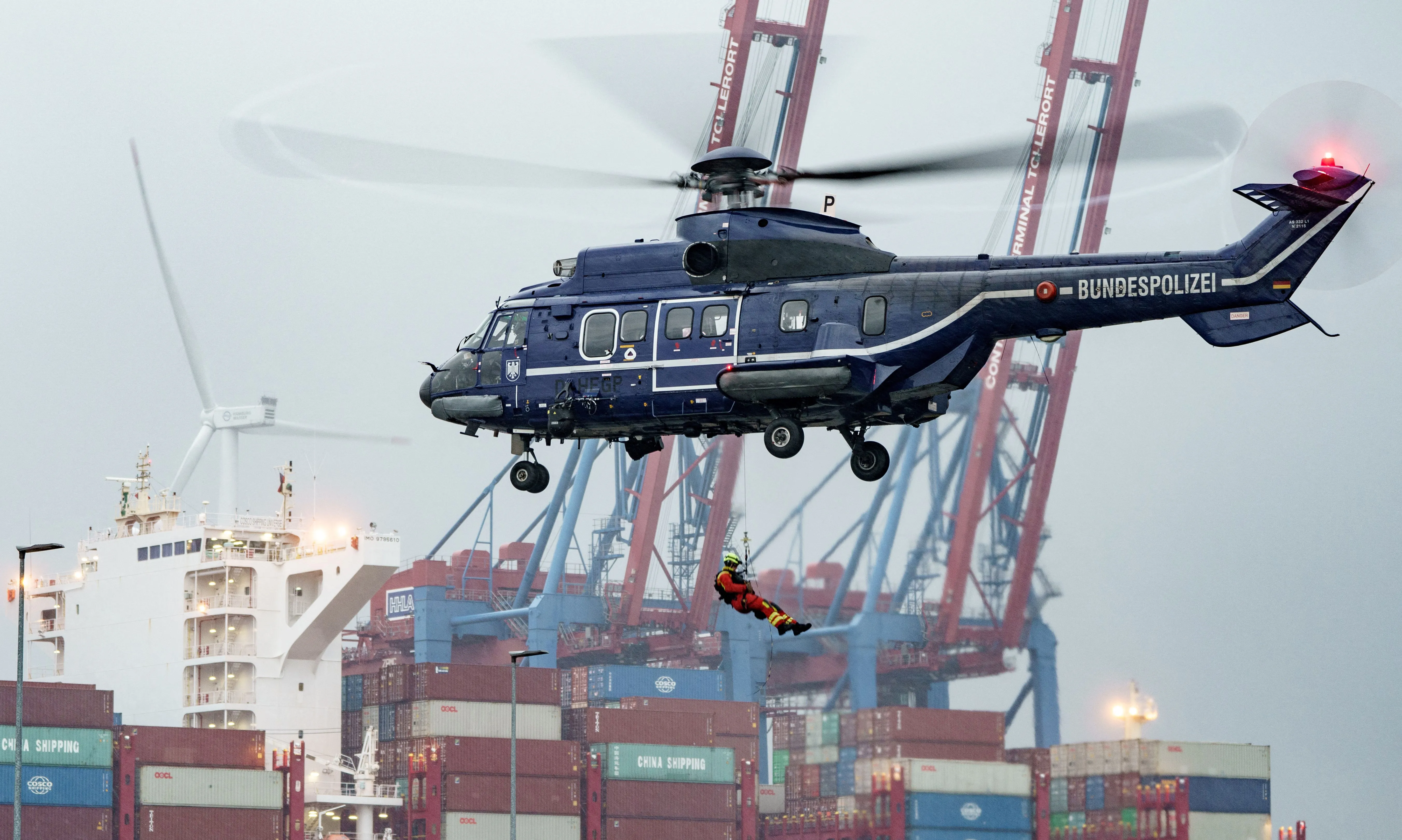 German Federal Police helicopter lowers emergency team in exercise