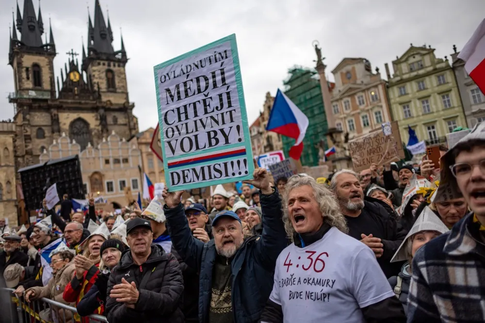 Czech government clears first hurdle to end TV and radio licence fees in 4.36am vote amid noisy protests